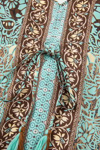 Open-back green dress side view